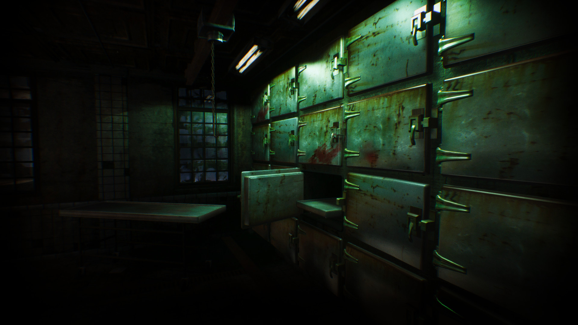 ASYLUM gameplay screenshot showing a dark morgue inside Hanwell Mental Institute, with rusted body storage doors, one drawer open and a metal table under green light