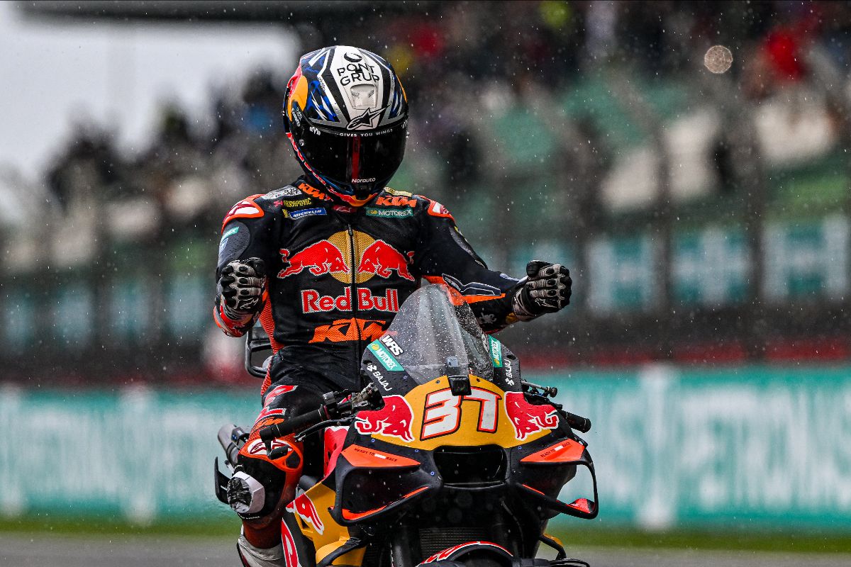 Pedro Acosta, number 37, in Red Bull KTM leathers celebrating on his KTM bike in the rain after winning the Sprint at Sepang for the PETRONAS Grand Prix of Malaysia