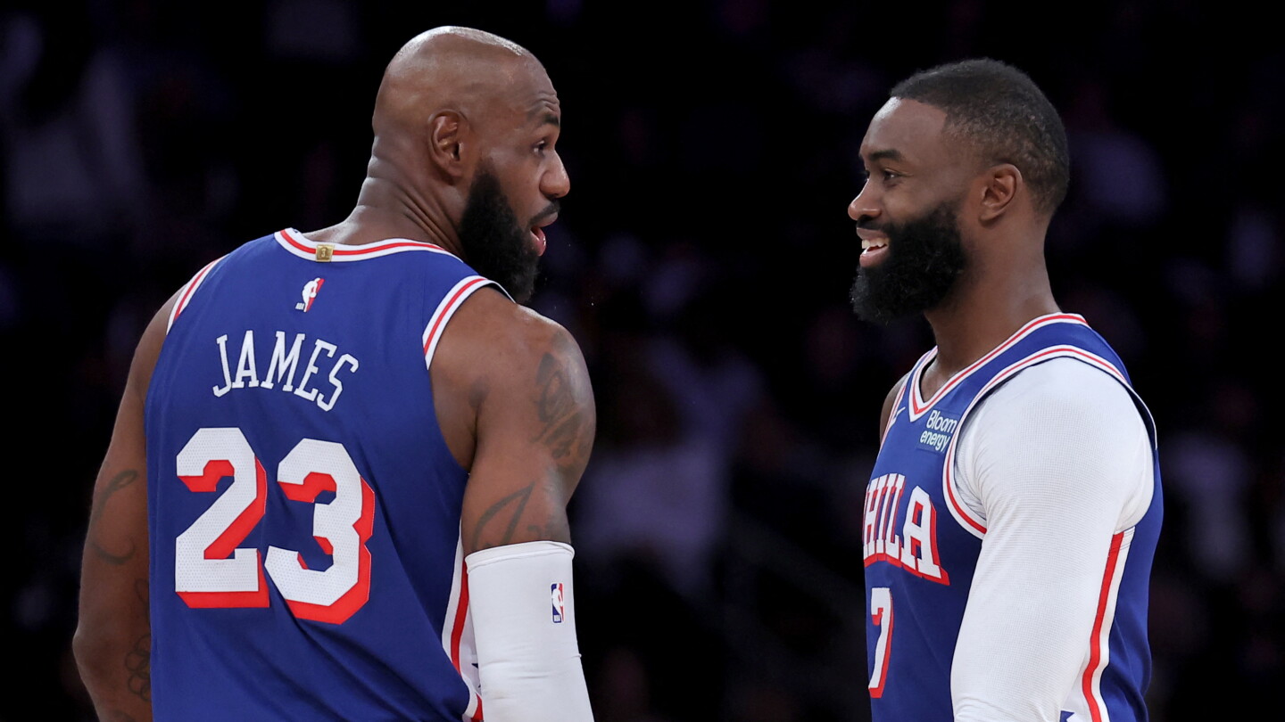 LeBron James talks with Jaylen Brown during the Philadelphia 76ers' win at Madison Square Garden