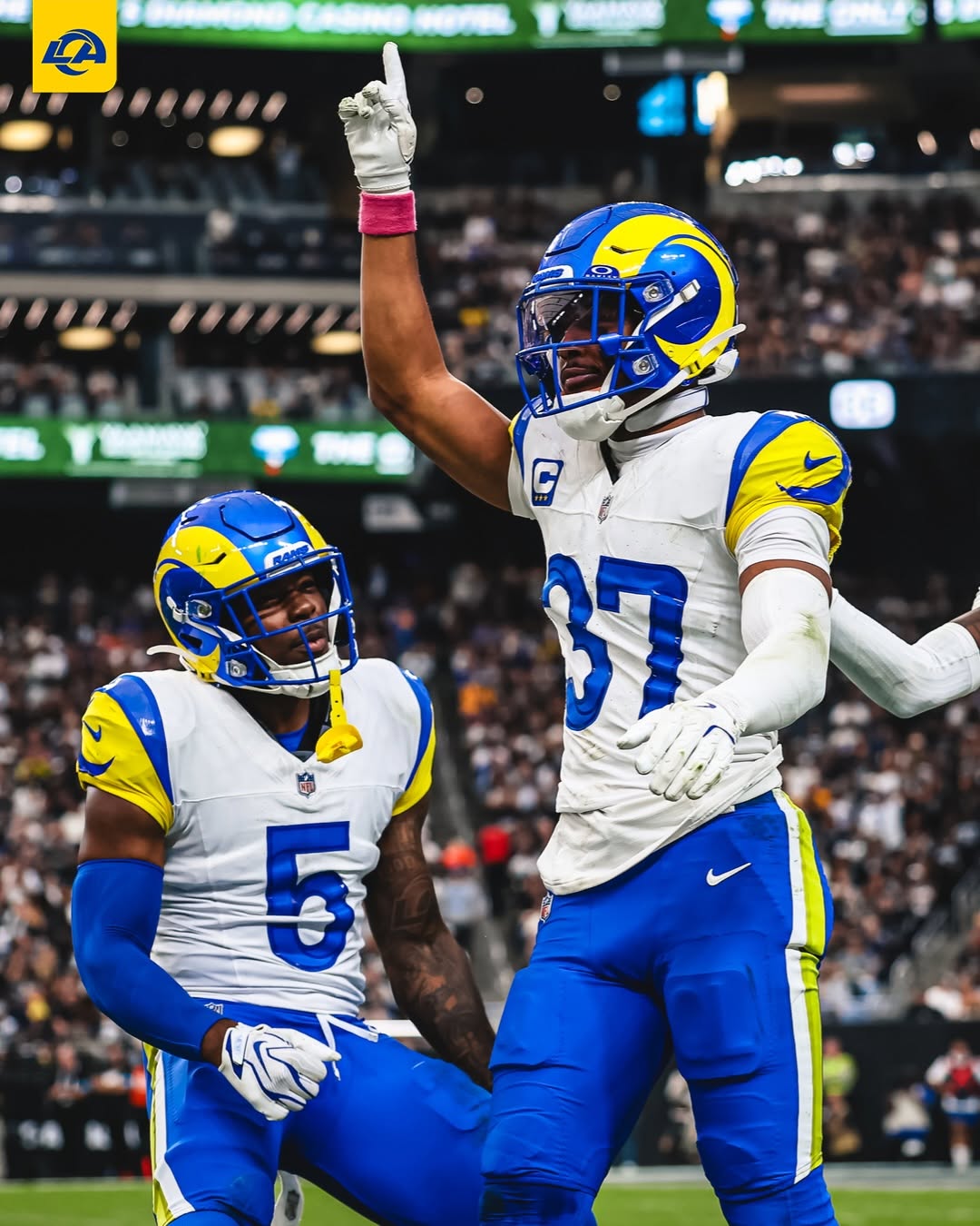 Los Angeles Rams players celebrate on the field after the win over the Las Vegas Raiders