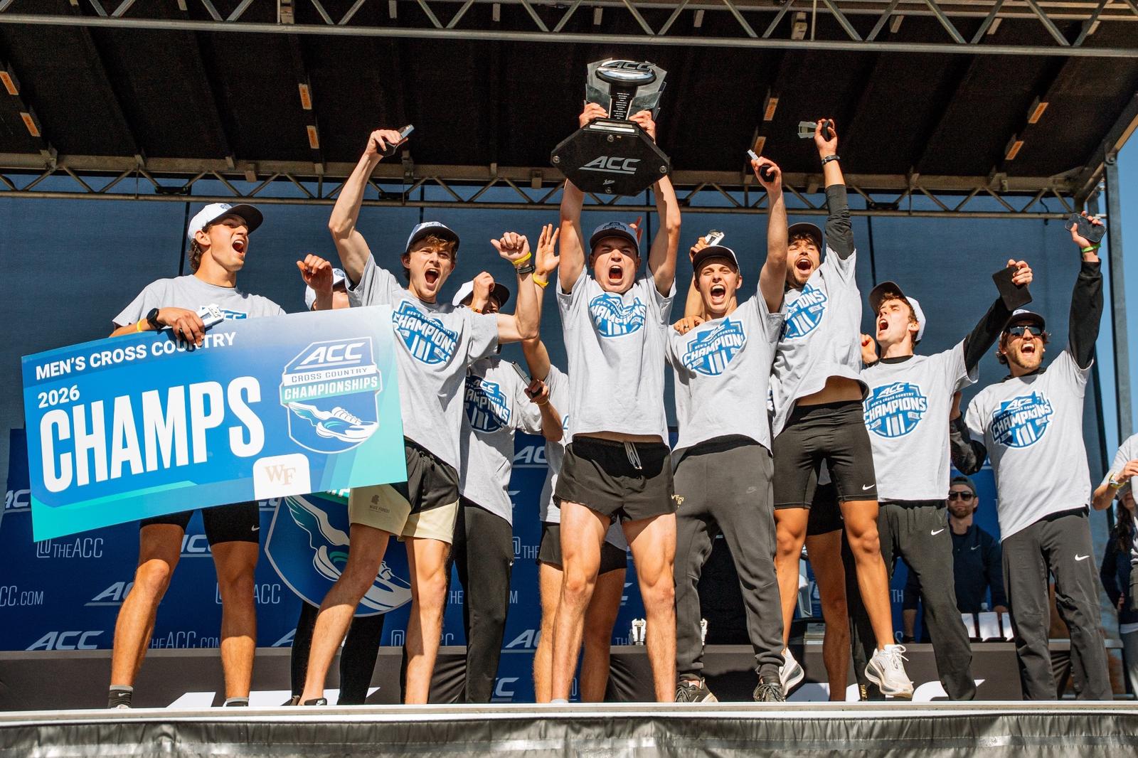 Wake Forest men's cross country team celebrates on the podium, hoisting the ACC trophy after winning the 2026 ACC Cross Country Championships in Blacksburg, Virginia