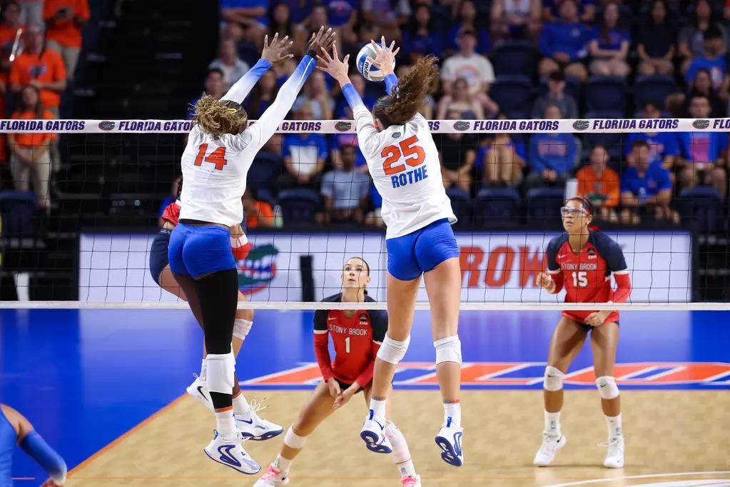 Florida Gators middle blocker Alec Rothe (25) rises for a block at the net during a 2026 match in Gainesville.
