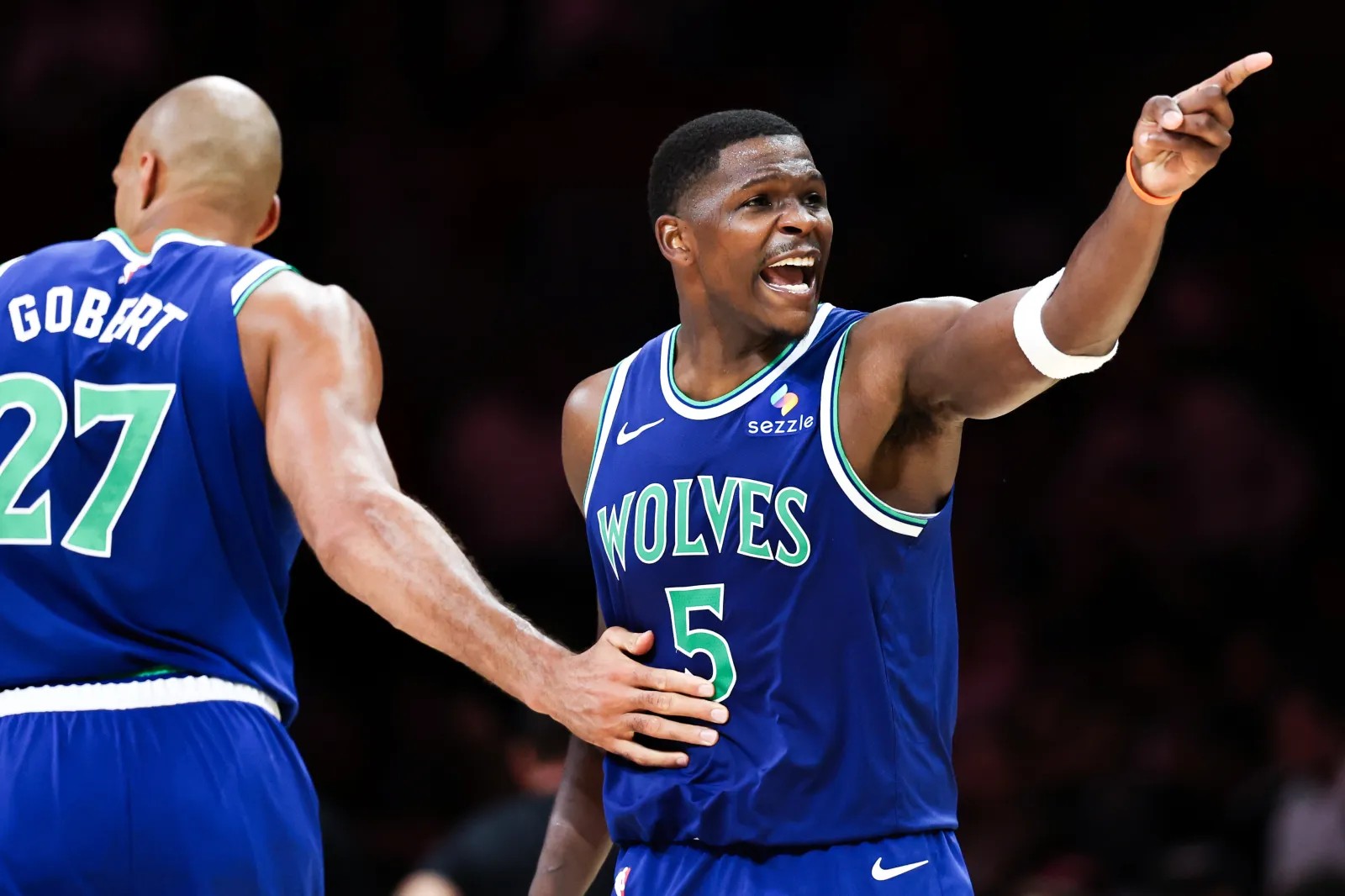 Anthony Edwards celebrates with Rudy Gobert during the Minnesota Timberwolves season opener against the Miami Heat at Kaseya Center on October 21, 2026