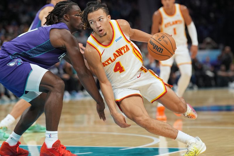 An Atlanta Hawks player drives against the Charlotte Hornets on Oct. 23, 2026