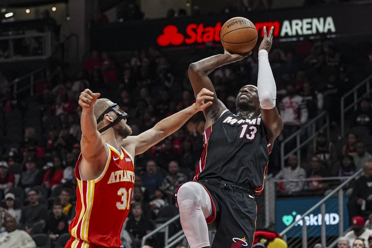 Miami Heat center Bam Adebayo shoots over Atlanta Hawks center Jock Landale during the first half on Oct. 28, 2026 at State Farm Arena in Atlanta
