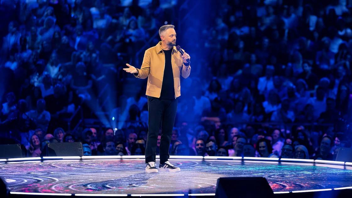 Nate Bargatze performing on stage
