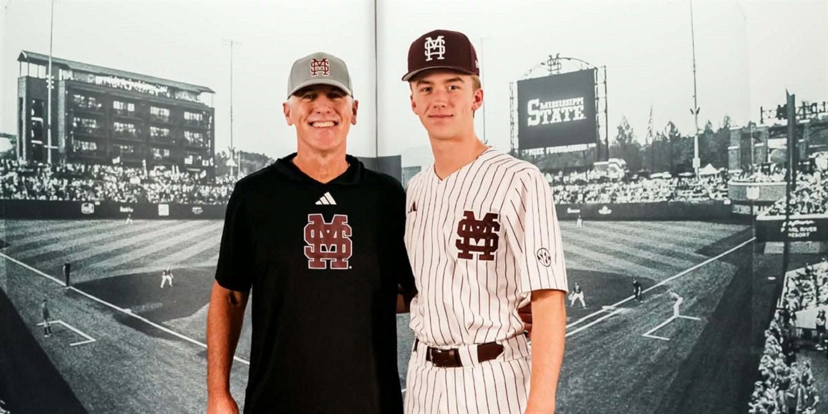 2028 left-handed pitcher Greyson Bell poses in a Mississippi State uniform alongside head coach Brian O'Connor during his visit to Starkville.