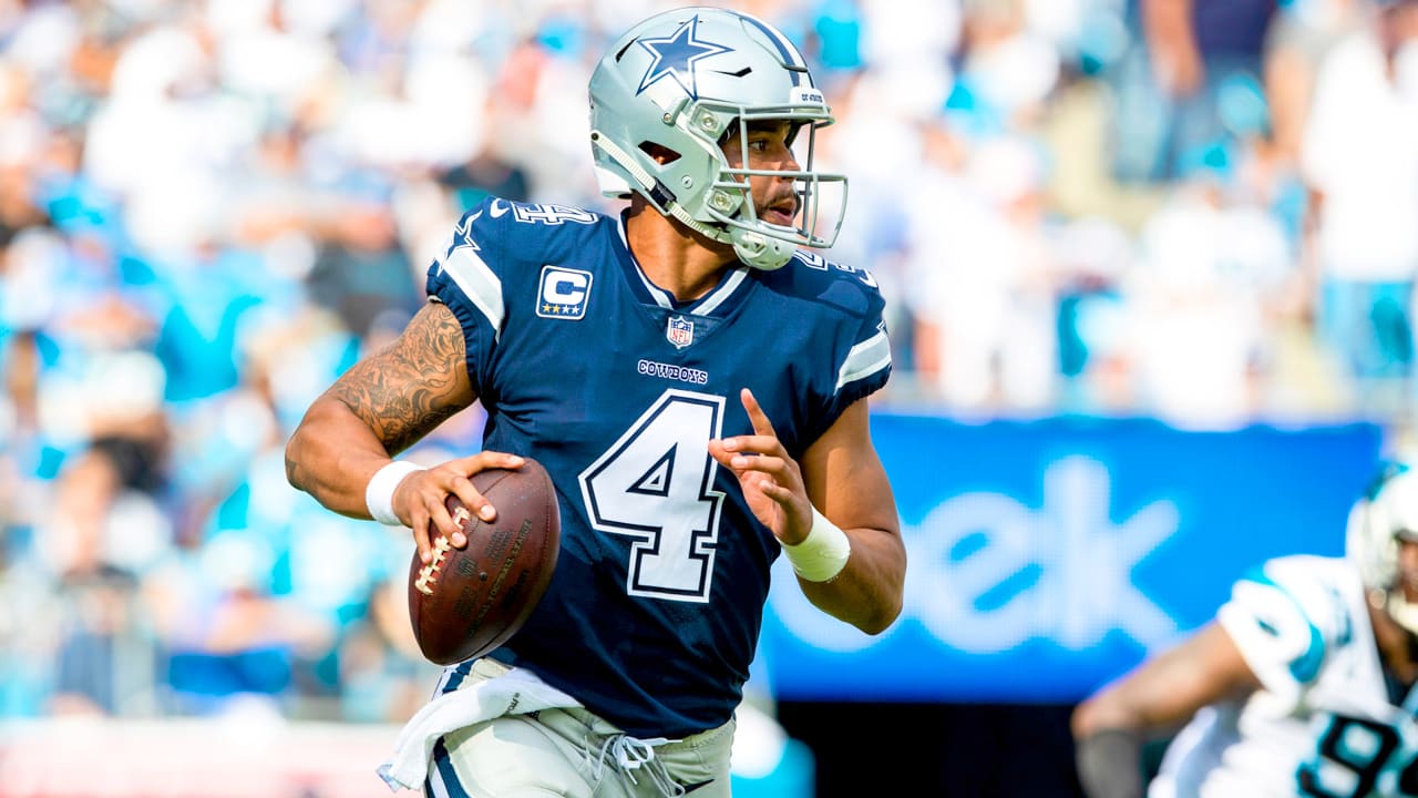 Dallas Cowboys quarterback Dak Prescott looks to throw during a game.