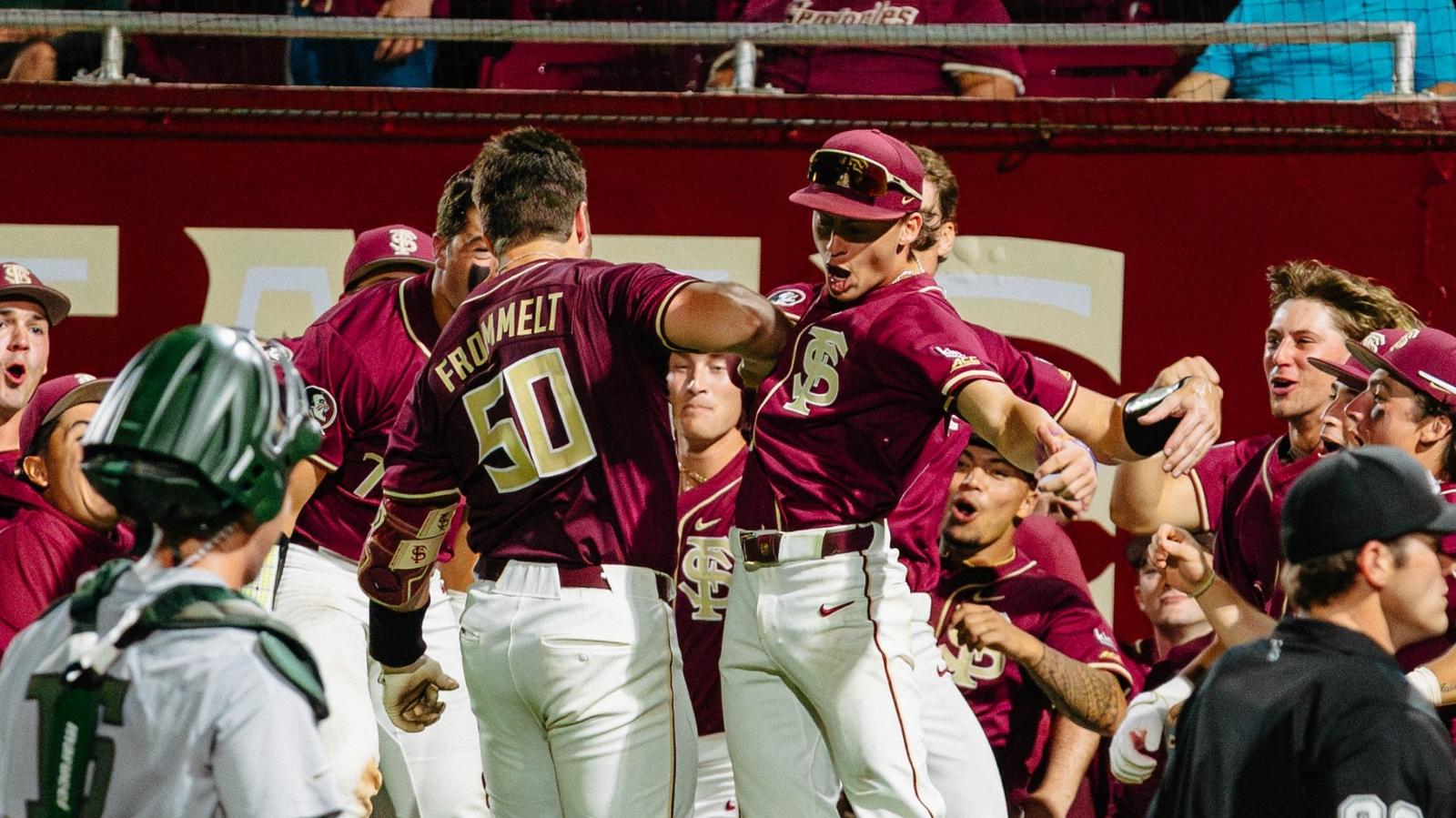 Florida State's Kaden Frommelt is mobbed by teammates after his home run against Jacksonville at Dick Howser Stadium.