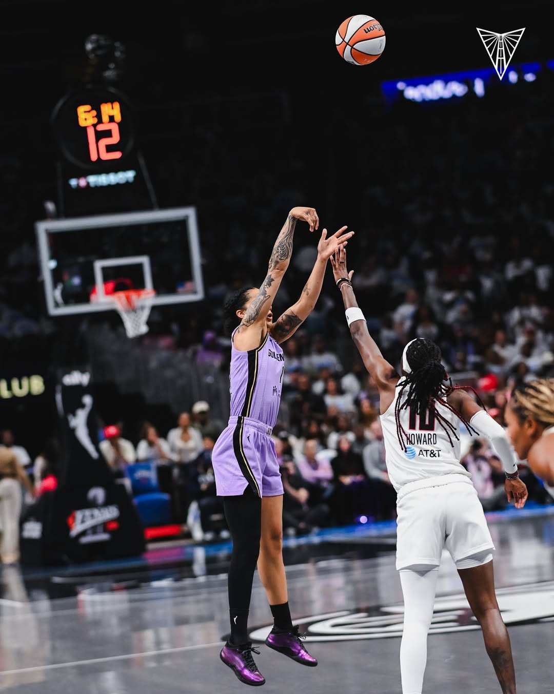 Tiffany Hayes shoots over Rhyne Howard during Game 4 of the WNBA Finals at State Farm Arena