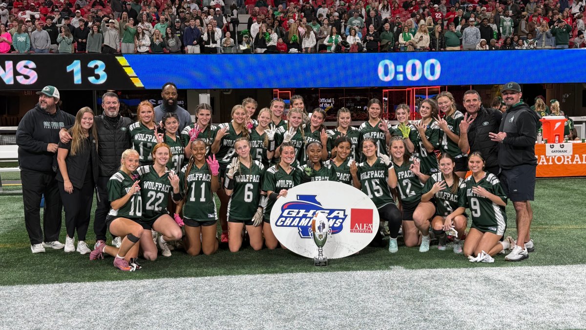 Greenbrier poses with the GHSA championship trophy after winning its third straight Division 2 title at Mercedes-Benz Stadium.