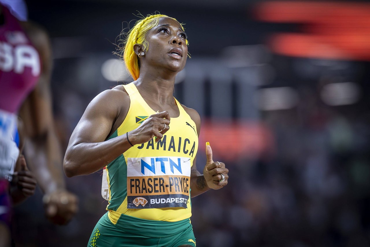 Shelly-Ann Fraser-Pryce racing in Jamaica colours