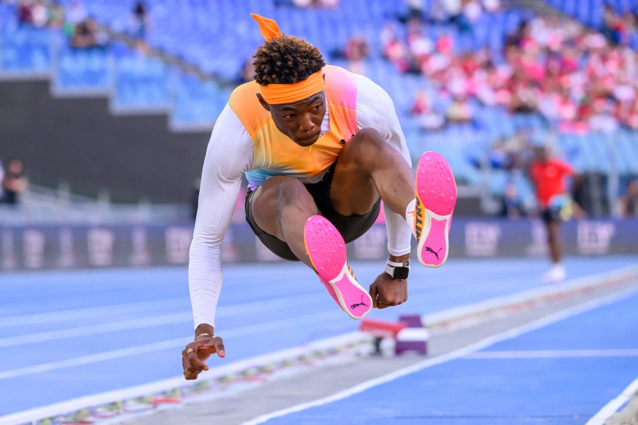 Jaydon Hibbert in full flight during a triple jump competition