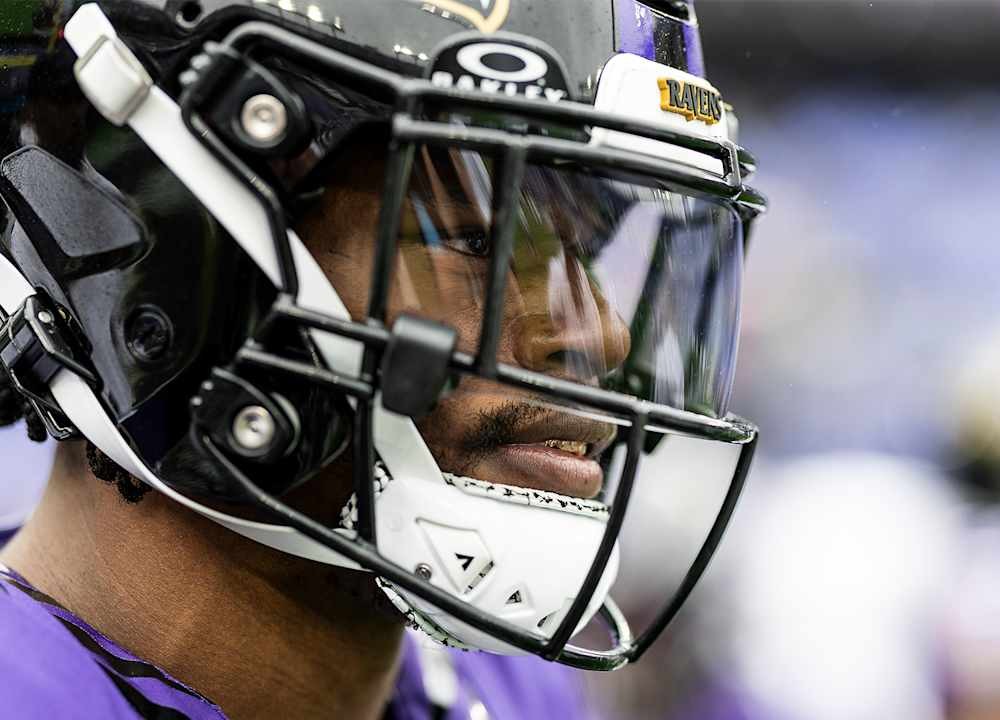 Baltimore Ravens quarterback Lamar Jackson in his helmet and purple jersey
