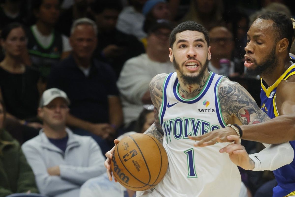 Minnesota Timberwolves guard LaMelo Ball works around Golden State Warriors center Charles Bassey in the first quarter on Oct. 28, 2026 at Target Center in Minneapolis