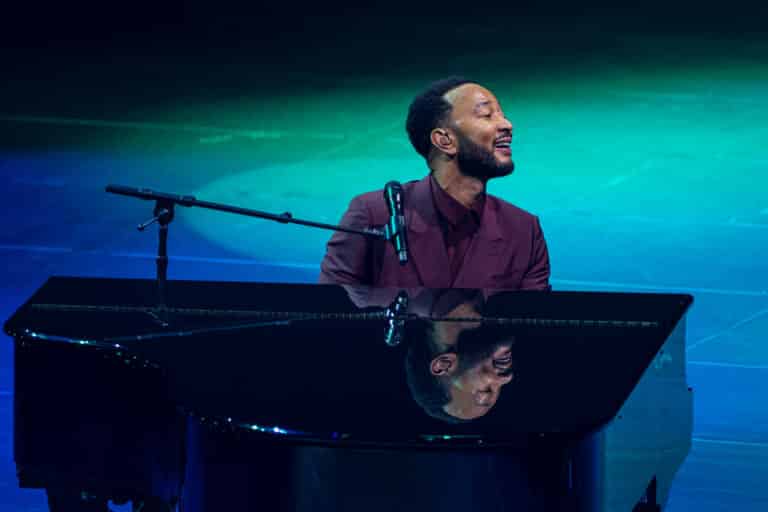 John Legend performing live at the piano in 2026