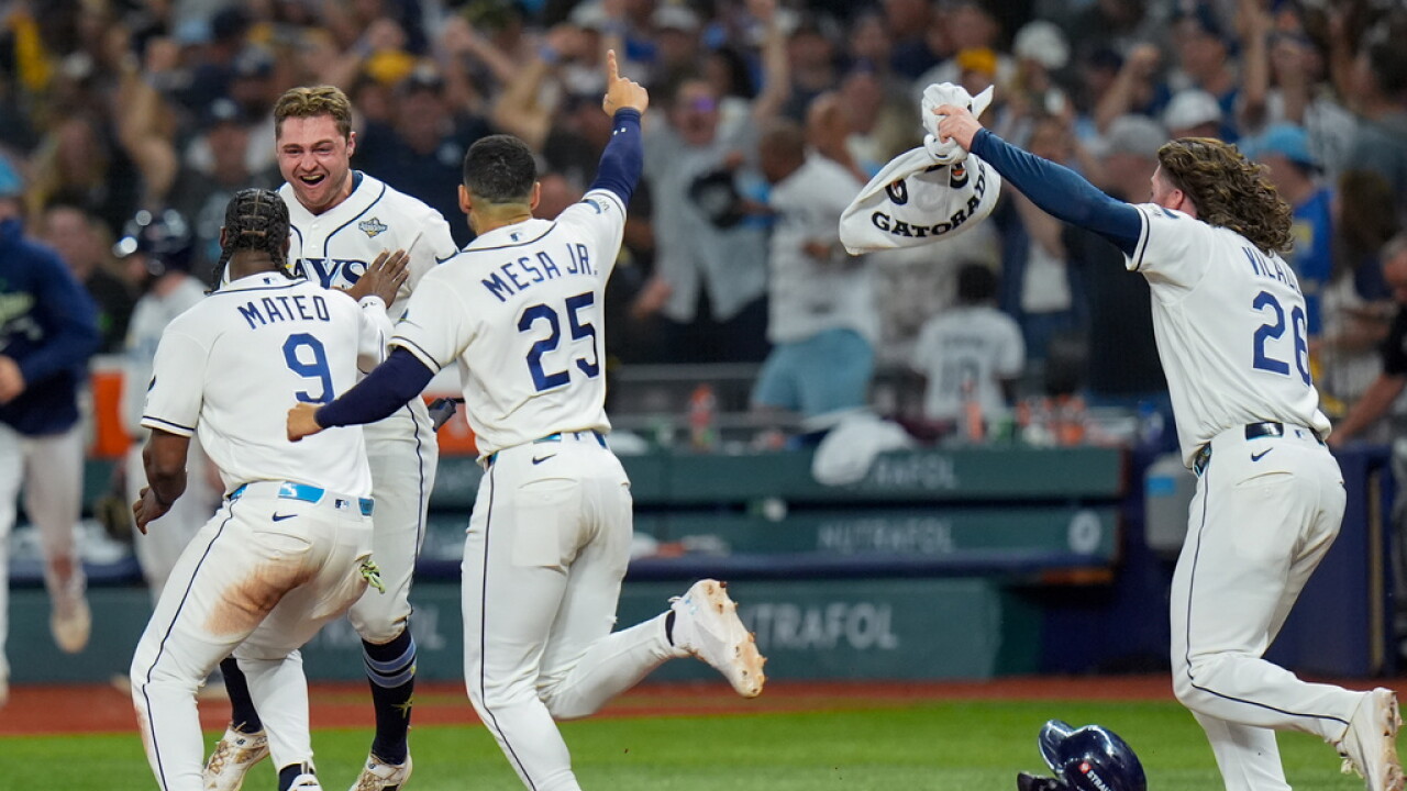 Tampa Bay Rays players celebrate Ben Williamson's walk-off single in the 12th inning of World Series Game 4 on Oct. 27, 2026 in St. Petersburg