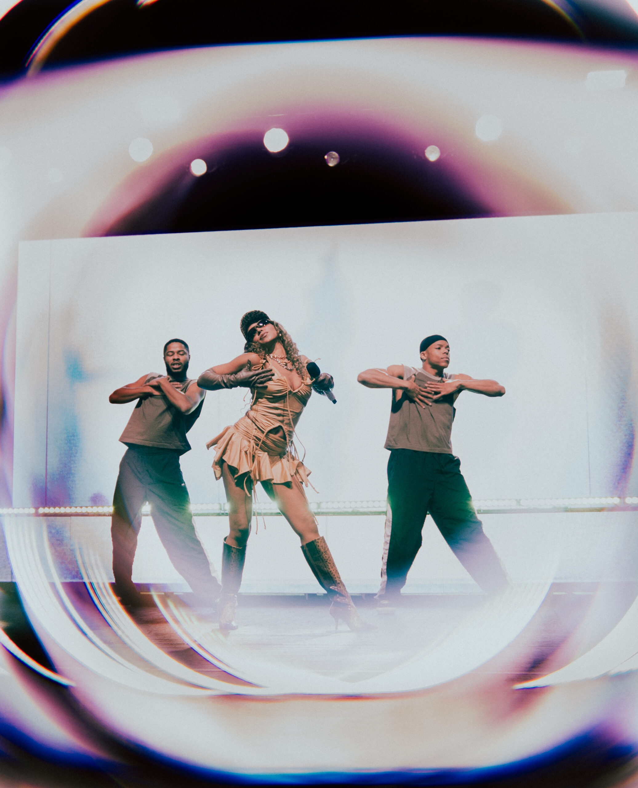 Tinashe performing live on stage with her dancers